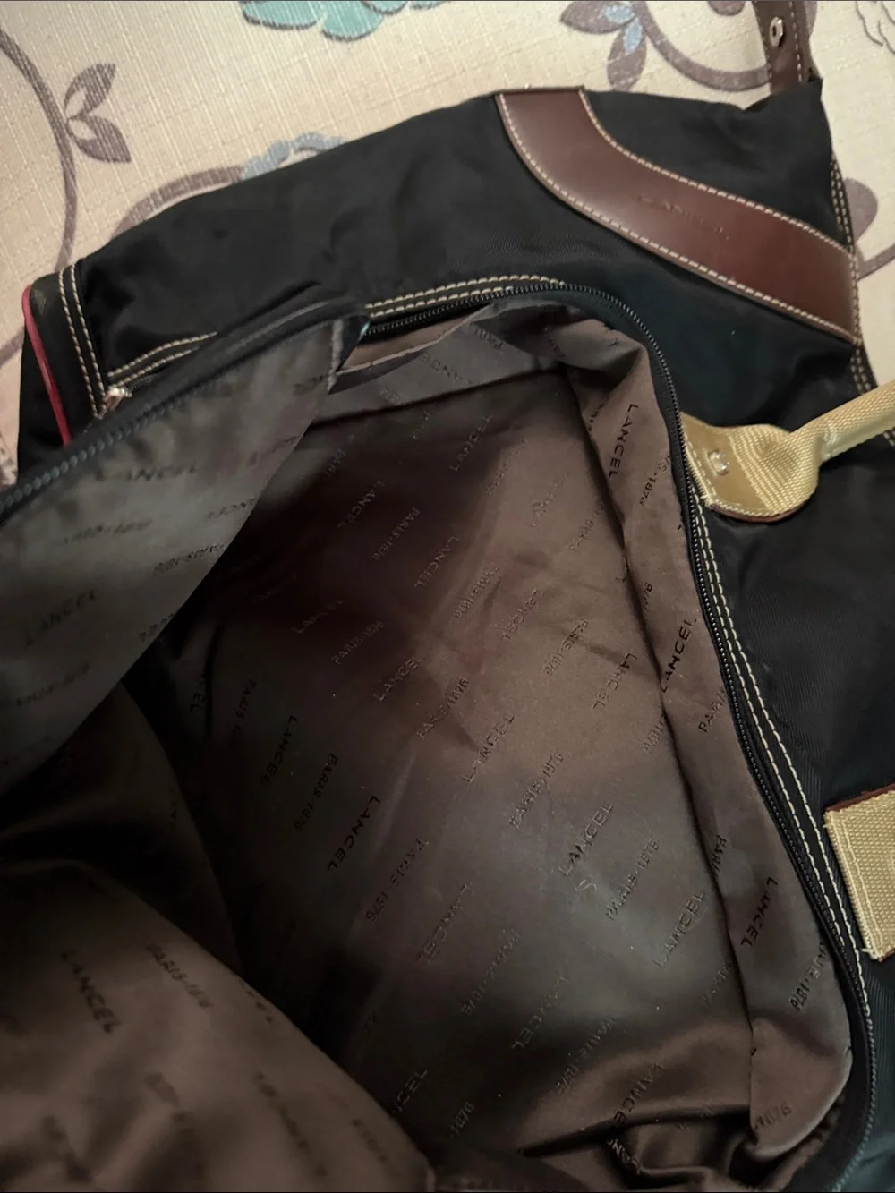 Black Duffel Bag with Tan Handles and Brown Accents